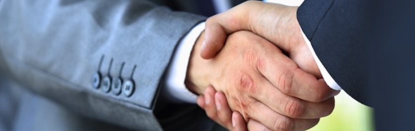 Photo of People Shaking Hands