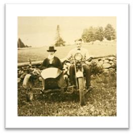 Old Photo of Two Men on a Motorcycle