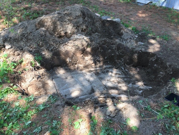 Photo of unearthed septic tank lids